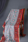 A classic patola in aqua blue with a striking contrast red