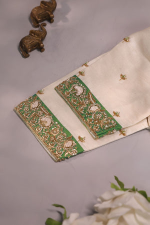 Green Tissue Kanchi saree with a contrast off white blouse