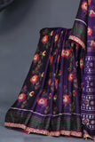 A classic patola in purple with a striking border