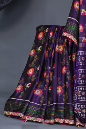A classic patola in purple with a striking border