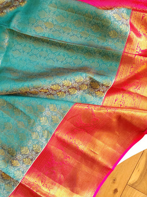 Turquoise Blue kanjeevaram saree with a contrast majenta pink border