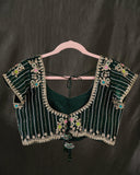 Banarasi Silk Saree in a dark emerald color