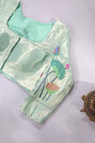 Muslin jamdaani in peach paired with a contrast mint green paithani blouse