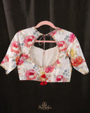 A beautiful Floral blouse in off white with intricately designed embroidery