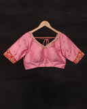 Raw Mango saree in red paired with a pink blouse