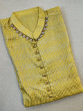 Lovely yellow silk kurta with Zari lines and hand embroidery across the neckline.