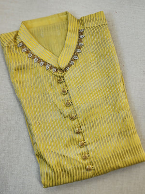 Lovely yellow silk kurta with Zari lines and hand embroidery across the neckline.