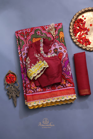 Patan Patola saree with intricately designed maggam work border