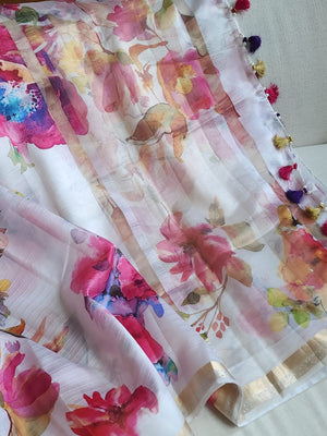 White floral pure silk saree with a contrast pink blouse