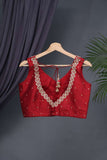 Red sleeveless blouse with handwork