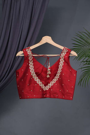 Red sleeveless blouse with handwork
