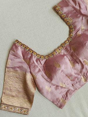 Raw  mango Pattu saree in maroon paired with a contrast mauve lilac blouse