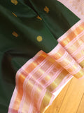 Kanjeevaram saree in bottle green with a baby pink border