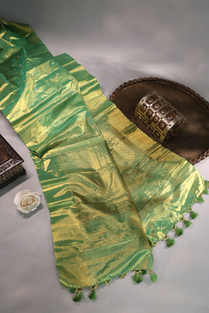 Green Tissue Kanchi saree with a contrast off white blouse