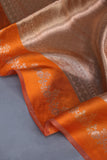 Banarasi brocade tissue saree in champagne with a beautiful light orange border