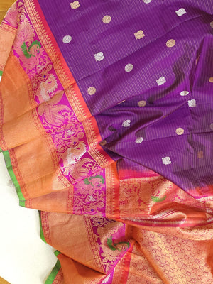 A Royal Gadwal kanchi saree in purple with contrast turning meena border