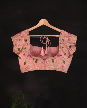 Soft organza saree in peach with a beautifully embroidered blouse