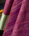 A kanjeevaram saree in purple with pastel green combo