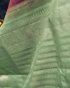 A kanjeevaram saree in purple with pastel green combo