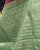 A kanjeevaram saree in purple with pastel green combo