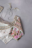 A beautiful rose pink tissue saree with an off white blouse