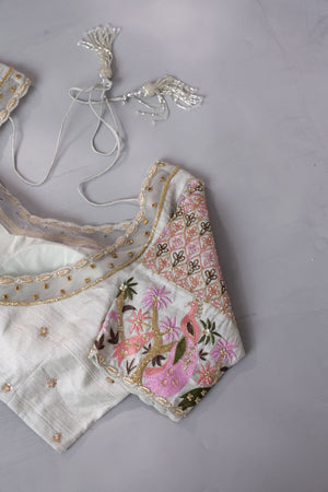 A beautiful rose pink tissue saree with an off white blouse