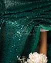 Dark bottle Green georgette sequins saree paired with a stunning blouse and belt