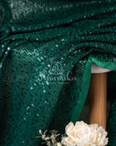 Dark bottle Green georgette sequins saree paired with a stunning blouse and belt