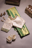 Green Tissue Kanchi saree with a contrast off white blouse