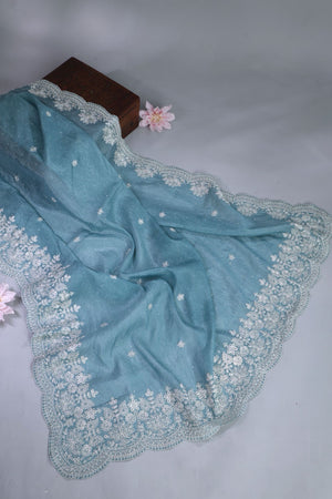 Elegant Crush Tissue saree in pastel blue with a stunning mirror work blouse
