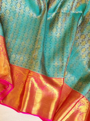 Turquoise Blue kanjeevaram saree with a contrast majenta pink border