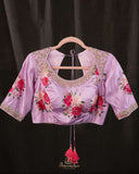 A beautiful Floral blouse in pastel pink with intricately designed embroidery