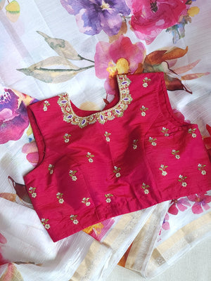 White floral pure silk saree with a contrast pink blouse