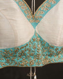 Off white blouse with blue patchwork embroidery