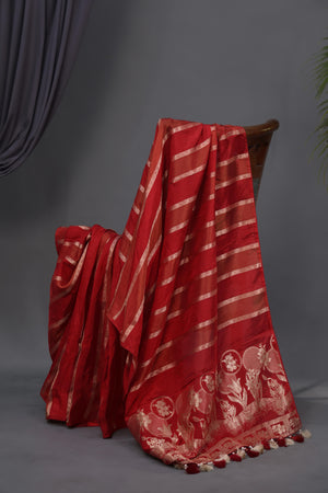 A striking red Mashru silk saree with a designer blouse
