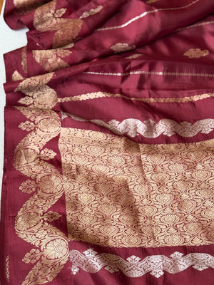Raw  mango Pattu saree in maroon paired with a contrast mauve lilac blouse