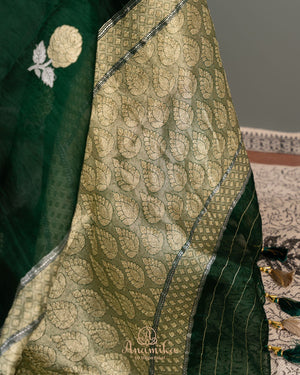 Banarasi Organza Saree in dark green with a floral blouse