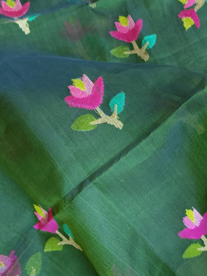 Bottle Green Jamdaani saree paired with a contrast yellow paithani blouse