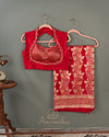 Red Banarasi Saree with a sleeveless blouse