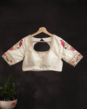 Off white blouse with beautifully designed Patola-inspired embroidery