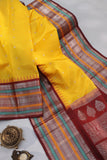 Radiant yellow Kanchipattu saree with maroon border