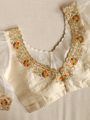 Deep Orange Munga silk saree with contrast off white puff sleeves blouse