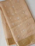 Banarasi Gold Tissue saree paired with a contrast maroon blouse