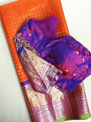 A grand Gadwal Kanchi saree in orange for your joyous occasions