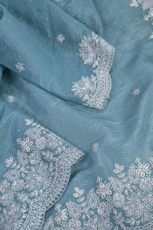 Elegant Crush Tissue saree in pastel blue with a stunning mirror work blouse