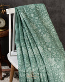 Organza saree in sage green with all over thread embroidery