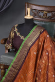 Rich kanjeevaram saree in rust orange and brown border
