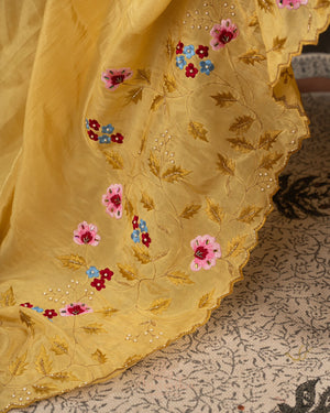 Lovely yellow tissue saree with beautiful thread embroidered border