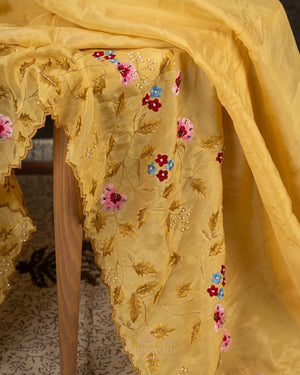 Lovely yellow tissue saree with beautiful thread embroidered border