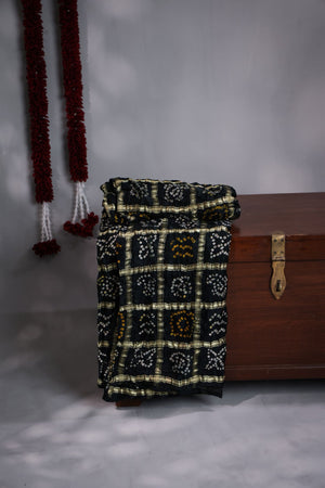 Black Bandini Gharchola saree with a showstopper blouse patter
